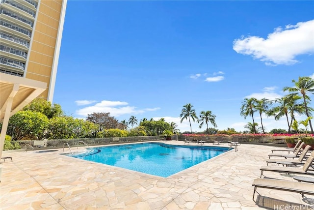 view of swimming pool featuring a patio