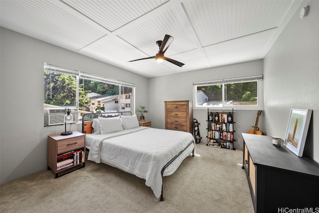 carpeted bedroom with cooling unit and ceiling fan