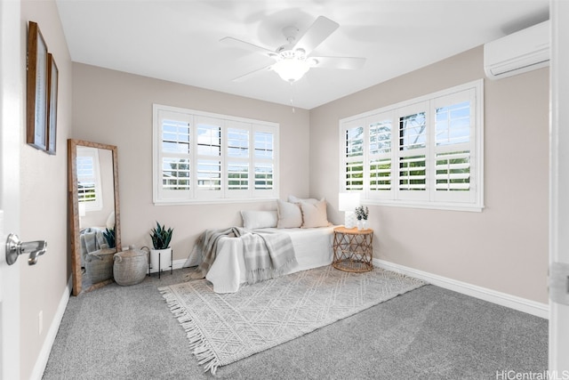 bedroom with an AC wall unit, ceiling fan, and carpet