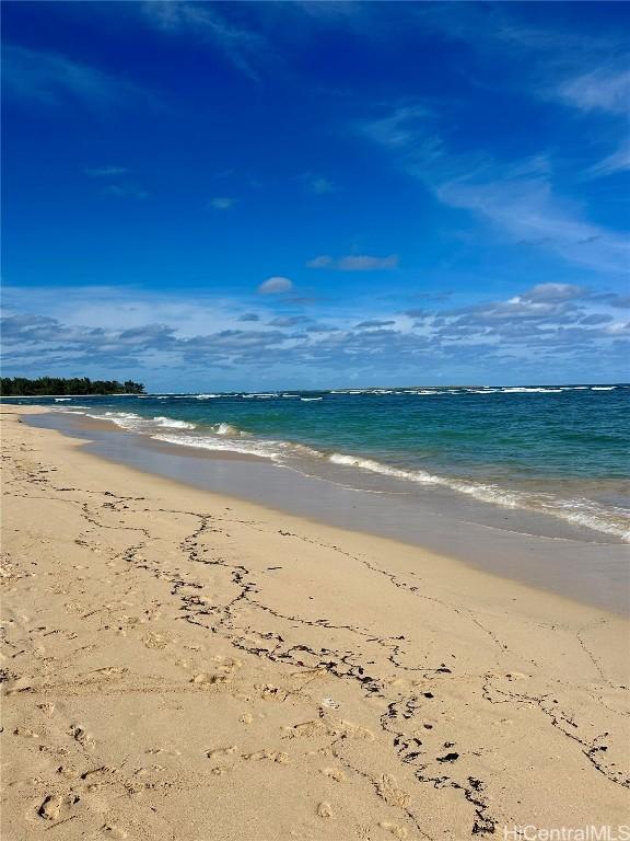 view of water feature with a beach view