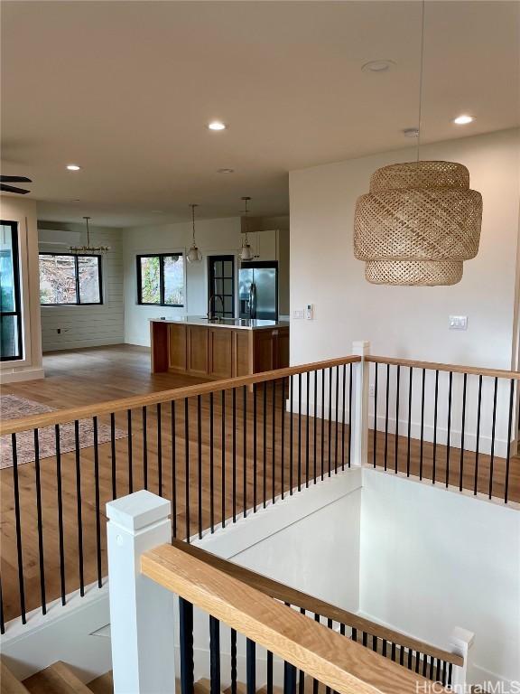 hallway with hardwood / wood-style floors