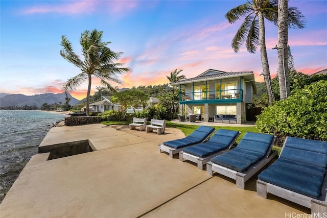 exterior space with outdoor lounge area, a patio, and a mountain view