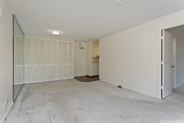 unfurnished bedroom with light colored carpet