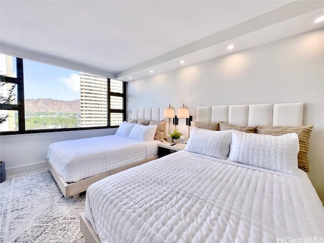 bedroom featuring a mountain view