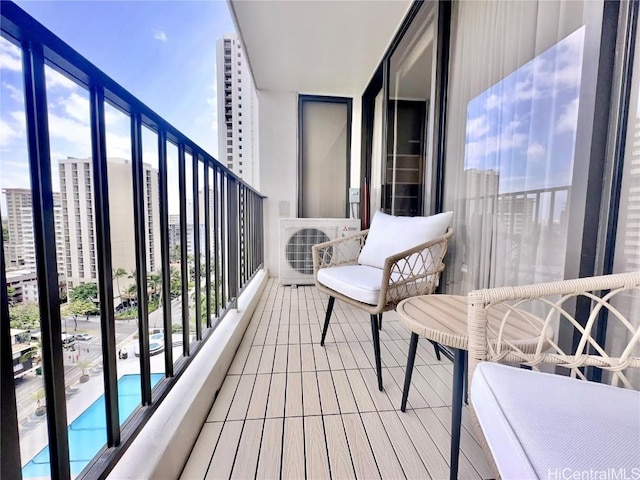 balcony featuring ac unit