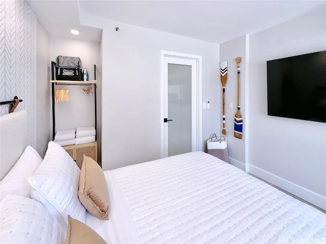 bedroom with recessed lighting and baseboards