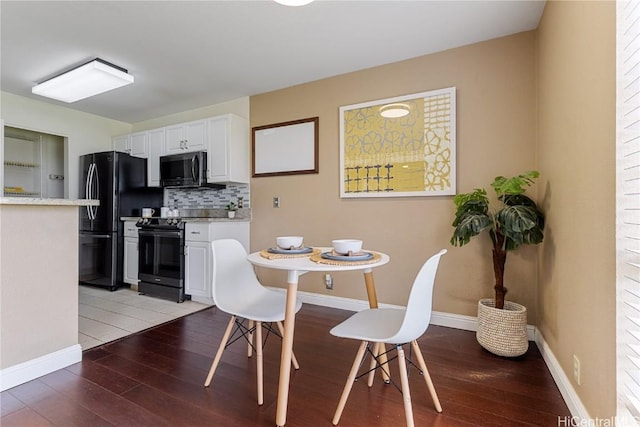 dining room featuring wood-type flooring