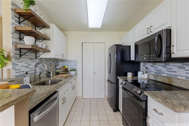 kitchen featuring sink, dishwasher, white cabinetry, light stone countertops, and black / electric stove