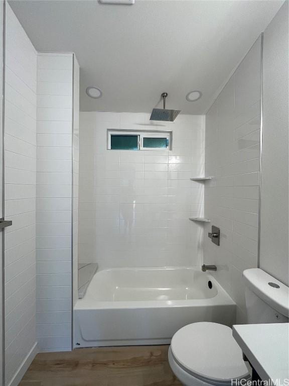 full bathroom with vanity, hardwood / wood-style flooring, bathing tub / shower combination, and toilet