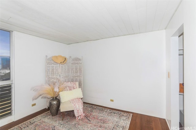 living area with hardwood / wood-style floors