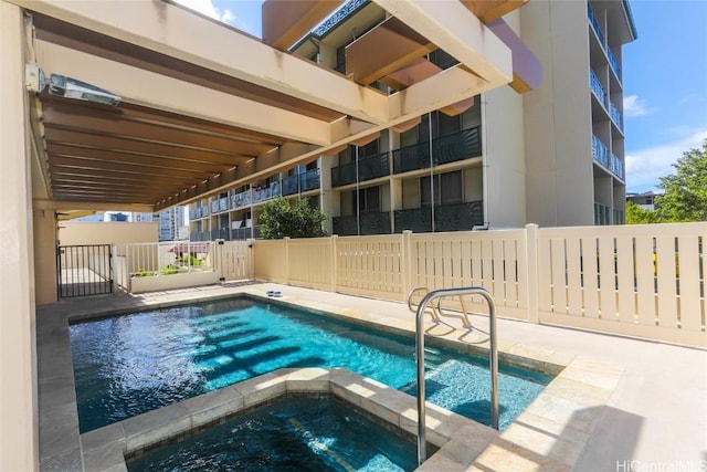 view of pool featuring a hot tub