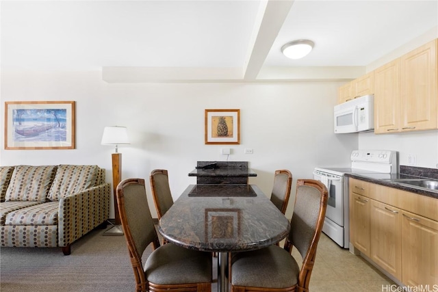 dining space featuring sink