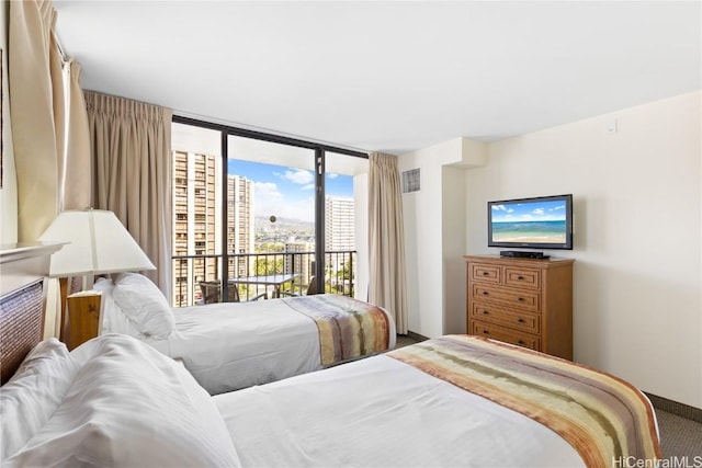 carpeted bedroom featuring access to exterior