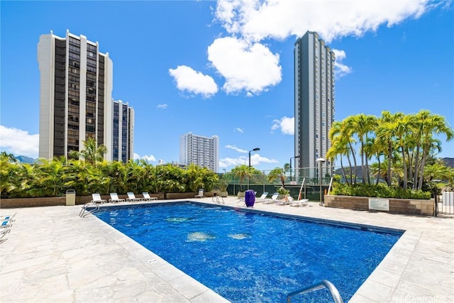 view of swimming pool with a patio area