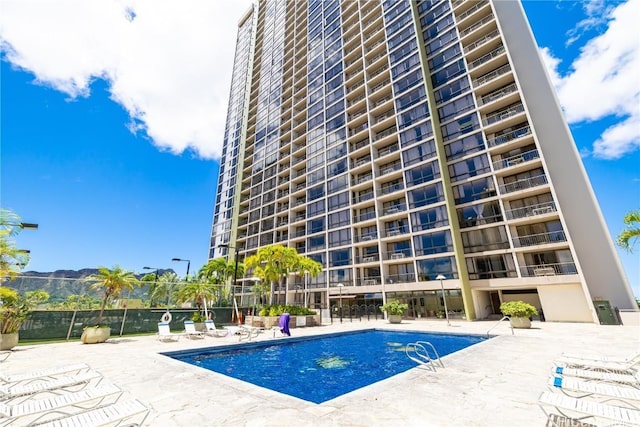 view of pool featuring a patio