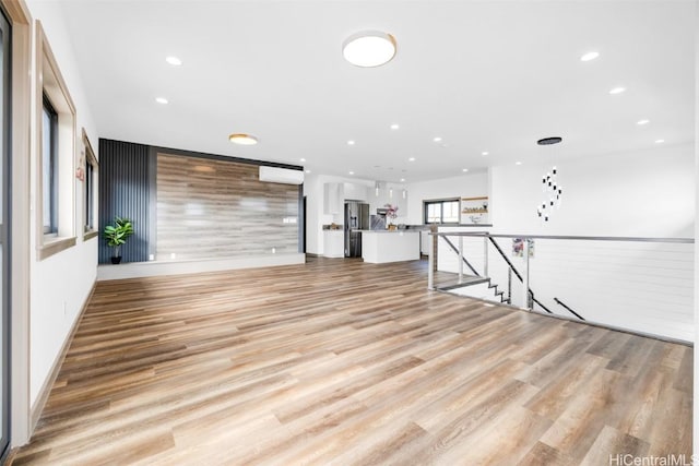 unfurnished living room featuring light wood-type flooring