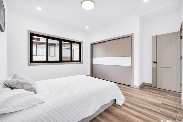 bedroom with a closet and light wood-type flooring