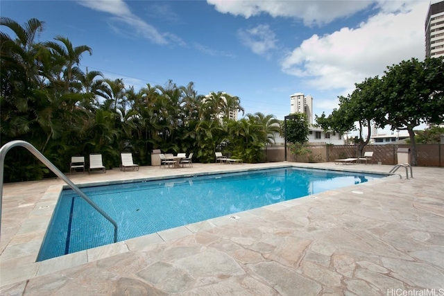 view of swimming pool with a patio area