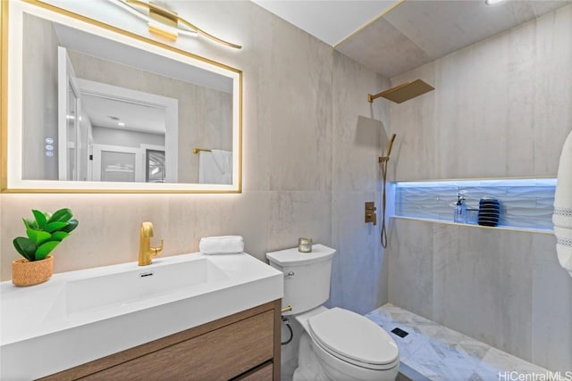 bathroom featuring walk in shower, vanity, and toilet