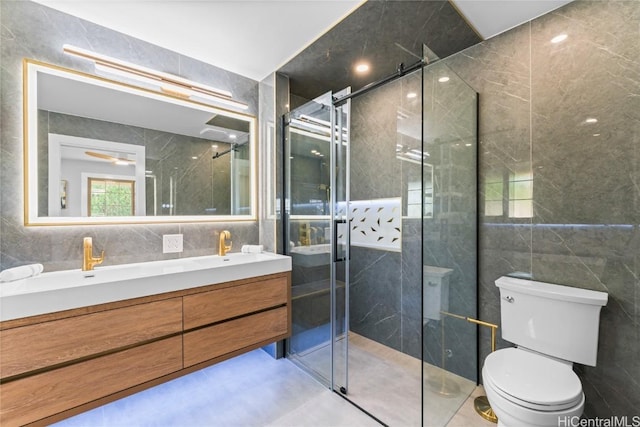 bathroom with walk in shower, vanity, toilet, and tile walls