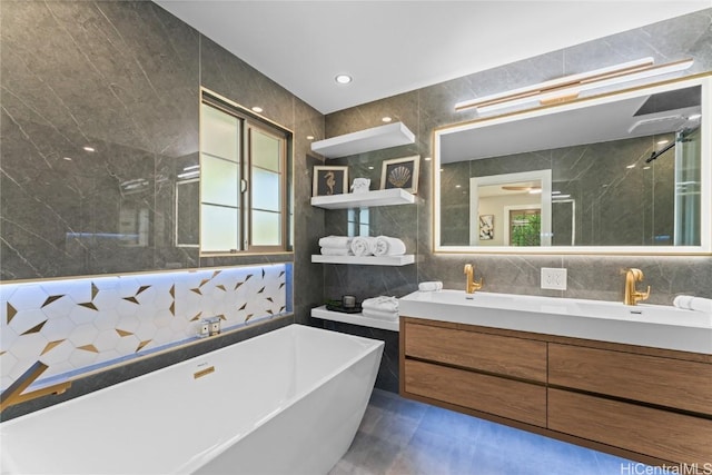 bathroom featuring tile walls, vanity, and shower with separate bathtub