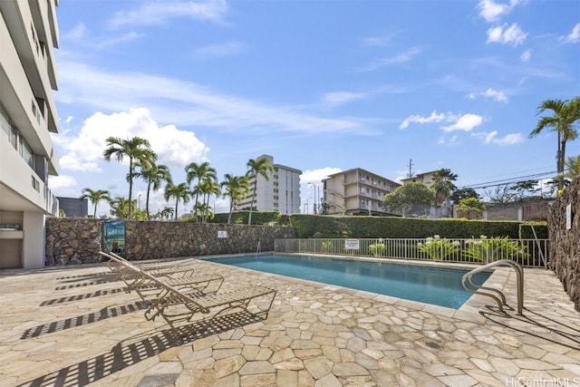 view of swimming pool with a patio