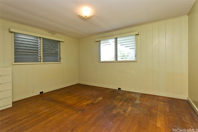 unfurnished room featuring hardwood / wood-style flooring