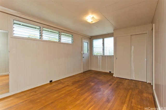 spare room featuring hardwood / wood-style flooring