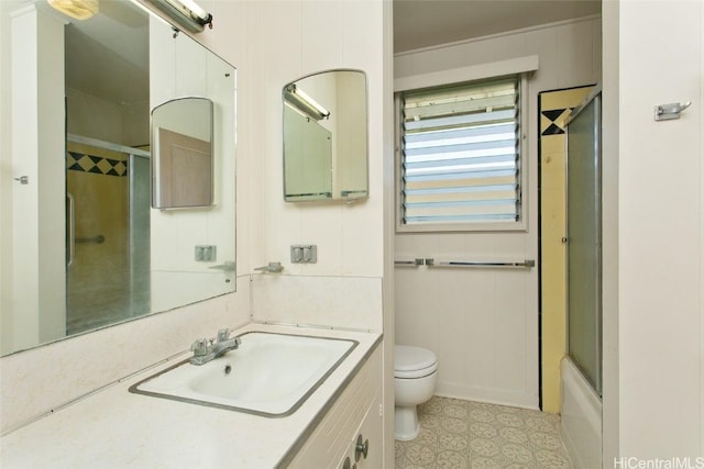 full bathroom with toilet and vanity