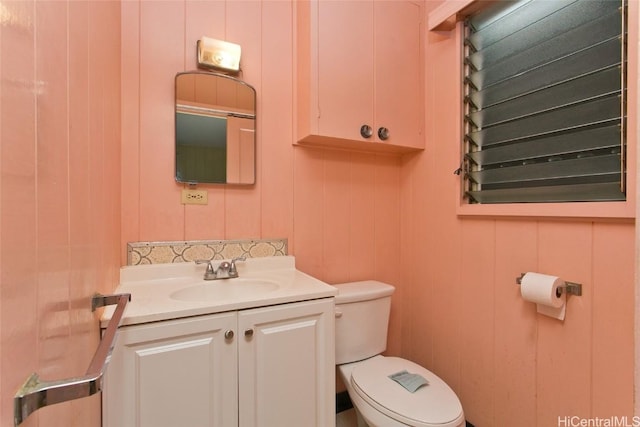 bathroom featuring toilet and vanity