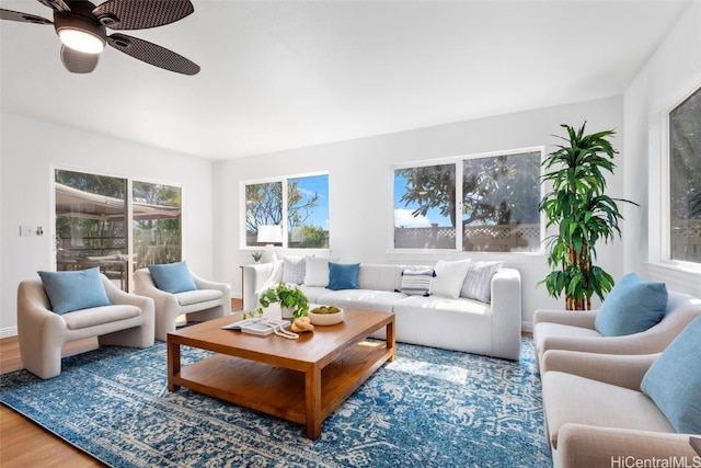 sunroom / solarium featuring ceiling fan