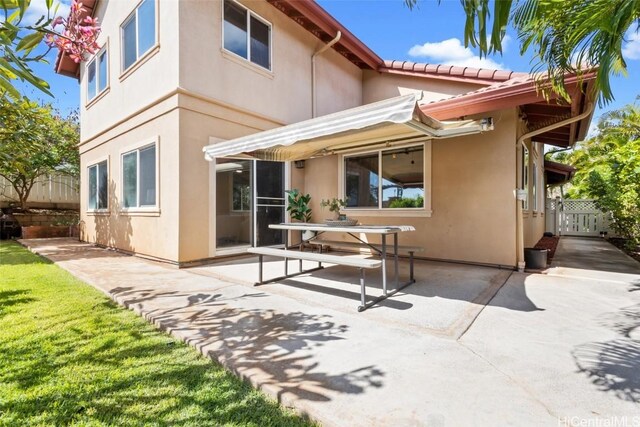 back of house with a patio area