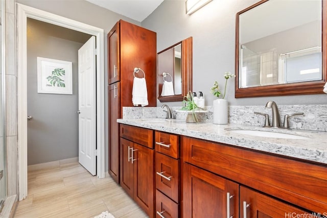 bathroom featuring vanity and an enclosed shower