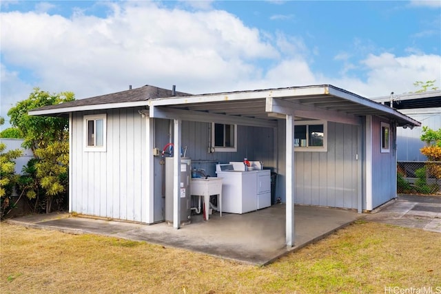 view of outbuilding featuring a carport and a yard