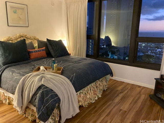 bedroom with hardwood / wood-style flooring