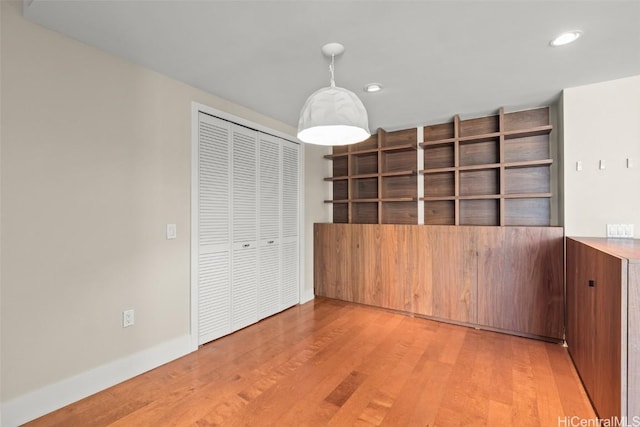 interior space featuring a closet and light wood-type flooring