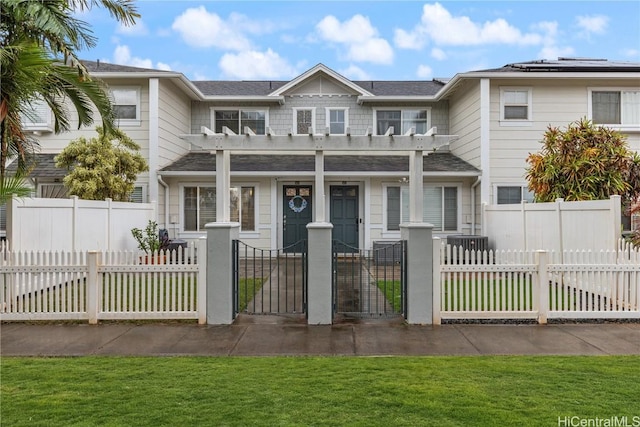 townhome / multi-family property with a pergola