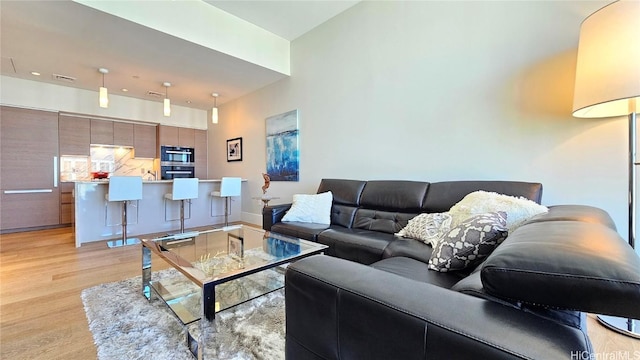 living room with light hardwood / wood-style floors