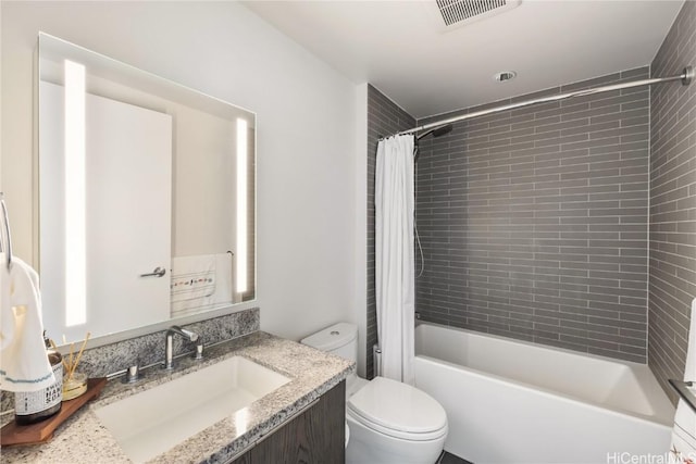 full bathroom featuring vanity, toilet, and shower / bath combo with shower curtain