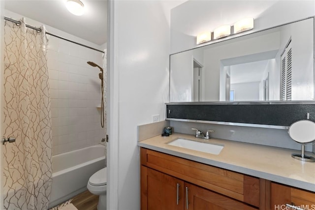 full bathroom featuring shower / bathtub combination with curtain, vanity, and toilet