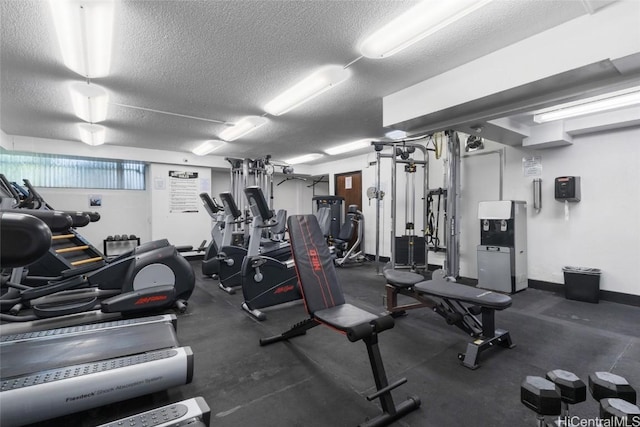 exercise room with a textured ceiling