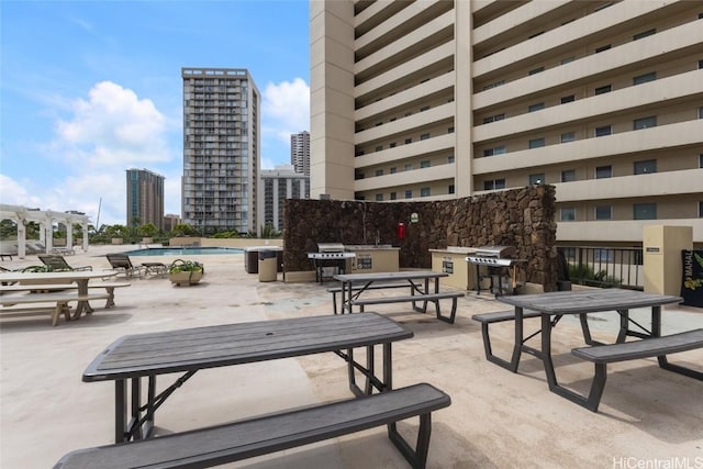 surrounding community featuring a pergola, a swimming pool, and a patio