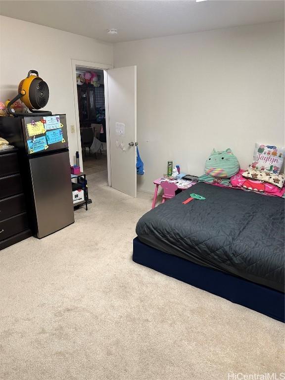 carpeted bedroom featuring a closet