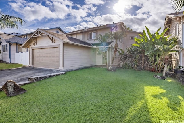 view of front facade featuring driveway, a garage, and a front lawn