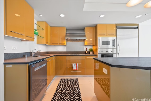 kitchen with built in appliances, extractor fan, light tile patterned floors, and sink