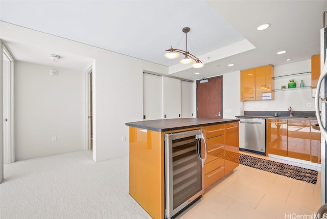 kitchen featuring sink, dishwasher, wine cooler, a kitchen island, and decorative light fixtures