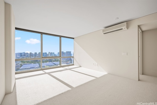 carpeted empty room featuring expansive windows, a view of city, and a wall mounted air conditioner