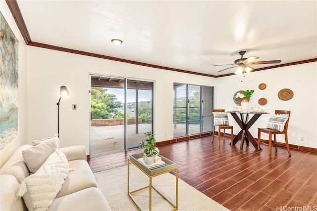 living room featuring crown molding, dark hardwood / wood-style floors, and ceiling fan