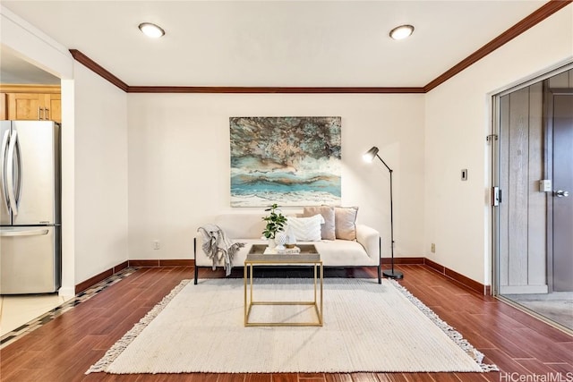 sitting room featuring dark hardwood / wood-style flooring and ornamental molding