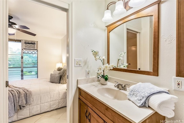 bathroom with tile patterned flooring, vanity, and ceiling fan